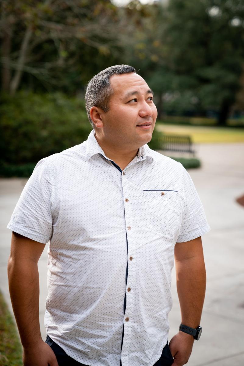 man in a white shirt looking at his right